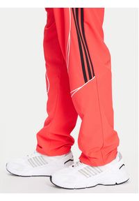 Adidas - adidas Spodnie dresowe Teamgeist adicolor JW5871 Czerwony Loose Fit. Kolor: czerwony. Materiał: syntetyk #4