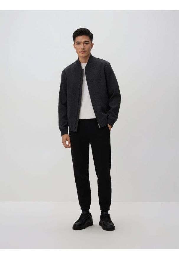 Reserved - Spodnie dresowe slim fit - czarny. Kolor: czarny. Materiał: dresówka