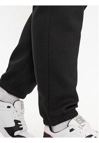 Champion Spodnie dresowe Elastic Cuff Pants 219420 Czarny Comfort Fit. Kolor: czarny. Materiał: dresówka, syntetyk, bawełna