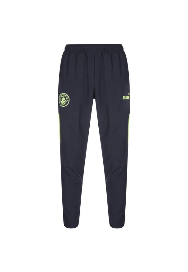 Puma - Spodnie przedmeczowe Manchester City 2022/23. Kolor: wielokolorowy, niebieski, żółty. Sport: piłka nożna