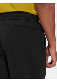 Calvin Klein Spodnie dresowe Grid Logo K10K112430 Czarny Relaxed Fit. Kolor: czarny. Materiał: bawełna #5