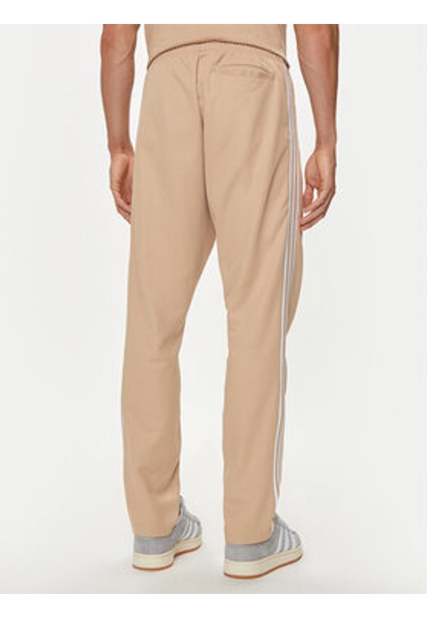 Adidas - adidas Spodnie dresowe adicolor Classics Beckenbauer IZ1857 Beżowy Slim Fit. Kolor: beżowy. Materiał: bawełna
