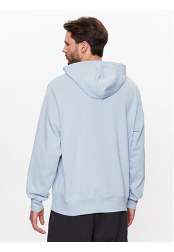 New Balance Bluza MT31537 Błękitny Relaxed Fit. Kolor: niebieski. Materiał: syntetyk, bawełna