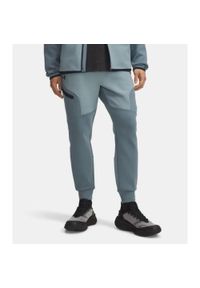 Spodnie Dresowe Męskie Under Armour. Kolor: niebieski. Materiał: dresówka. Sport: fitness #1