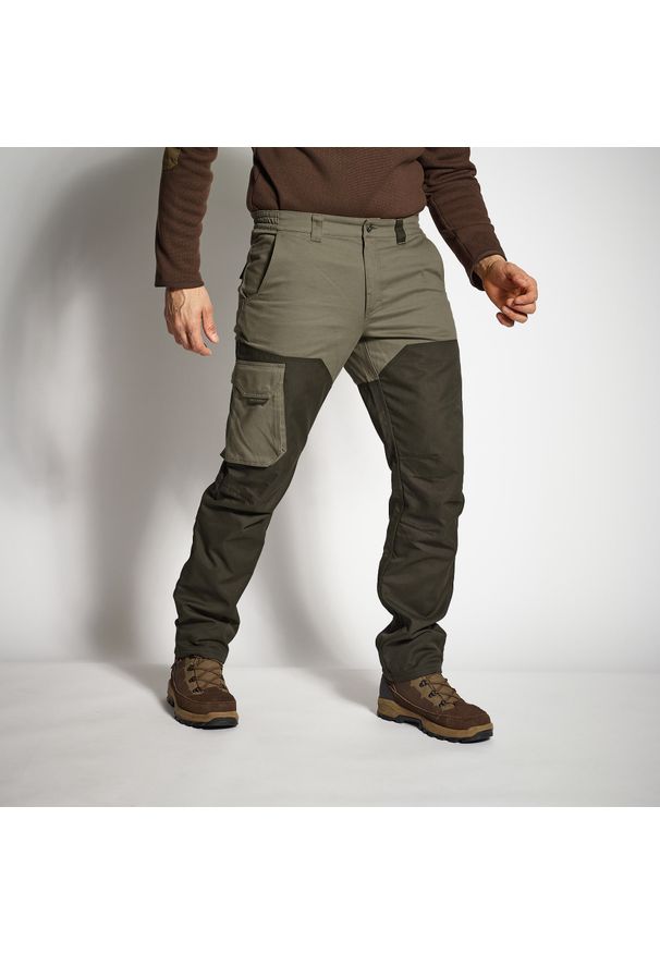 SOLOGNAC - Spodnie outdoor renfort Solognac 520 dwukolorowe. Kolor: zielony, brązowy, wielokolorowy. Materiał: materiał, bawełna, tkanina, poliester. Sport: outdoor