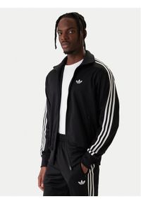 Adidas - adidas Bluza Firebird KD8312 Czarny Loose Fit. Kolor: czarny. Materiał: syntetyk #1