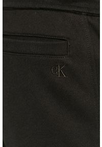 Calvin Klein Jeans - Spodnie. Kolor: czarny. Materiał: bawełna, dzianina. Wzór: gładki #4