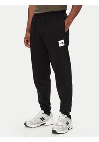 The North Face Spodnie dresowe Box Half Dome NF0A8JB0 Czarny Regular Fit. Kolor: czarny. Materiał: bawełna #1