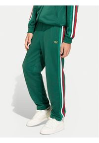 Adidas - adidas Spodnie dresowe Firebird KC9502 Zielony Regular Fit. Kolor: zielony. Materiał: syntetyk #1