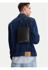 Calvin Klein Jeans Saszetka Mono Logo Flat Pack 18 LV04G3107G Czarny. Kolor: czarny. Materiał: skóra