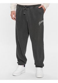 Tommy Jeans Spodnie dresowe DM0DM17696 Czarny Baggy Fit. Kolor: czarny. Materiał: bawełna