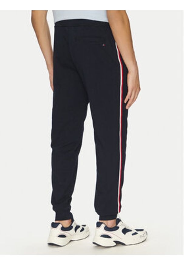 TOMMY HILFIGER - Tommy Hilfiger Spodnie dresowe Global Stripe MW0MW38696 Granatowy Regular Fit. Kolor: niebieski. Materiał: bawełna