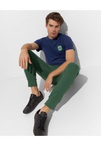 Lacoste - LACOSTE - Zielone spodnie dresowe Sport Tennis. Kolor: zielony. Materiał: dresówka. Wzór: haft