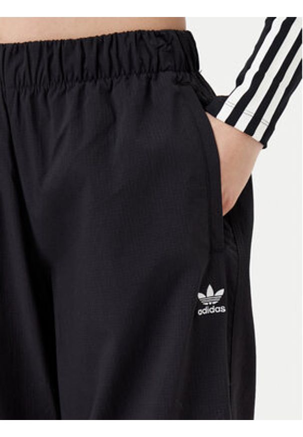 Adidas - adidas Spodnie dresowe Essentials Ripstop JD0785 Czarny Loose Fit. Kolor: czarny. Materiał: syntetyk