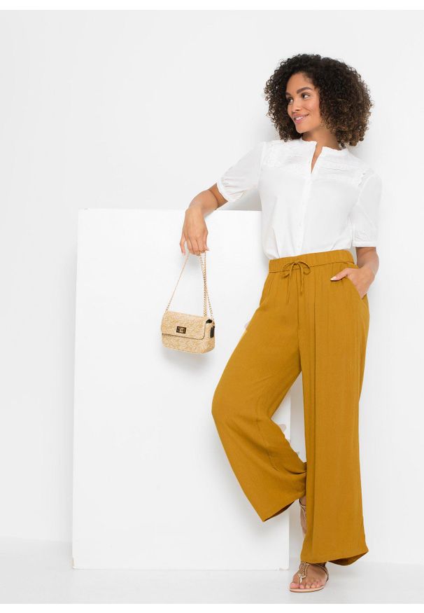 bonprix - Spodnie Marlena z lejącej wiskozy. Kolor: żółty. Materiał: wiskoza