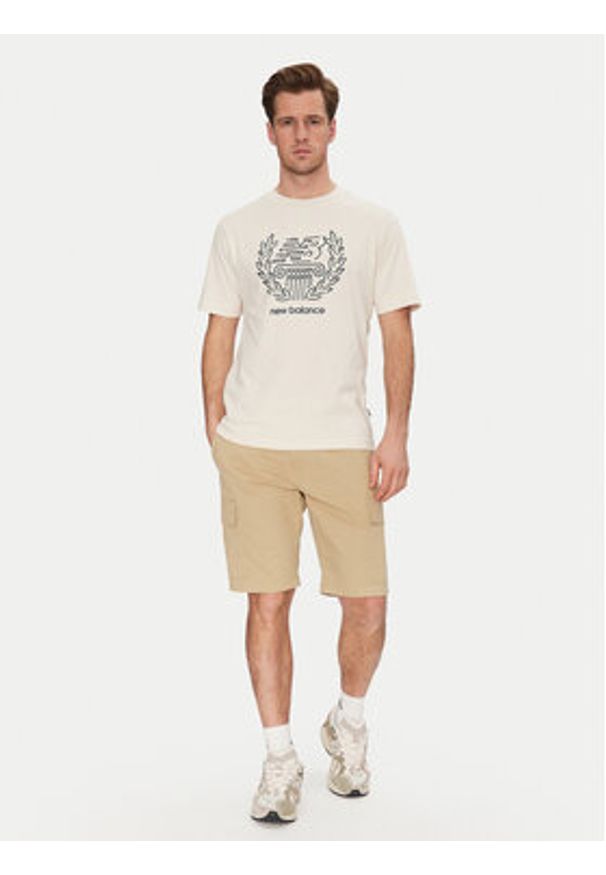 New Balance T-Shirt MT51974 Beżowy Relaxed Fit. Kolor: beżowy. Materiał: bawełna