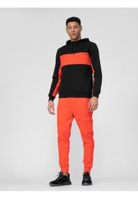 4f - Spodnie dresowe joggery męskie. Kolor: pomarańczowy. Materiał: dresówka