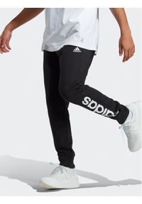 Adidas - adidas Spodnie dresowe Essentials French Terry Tapered Cuff Logo Joggers IC0063 Czarny Regular Fit. Kolor: czarny. Materiał: bawełna