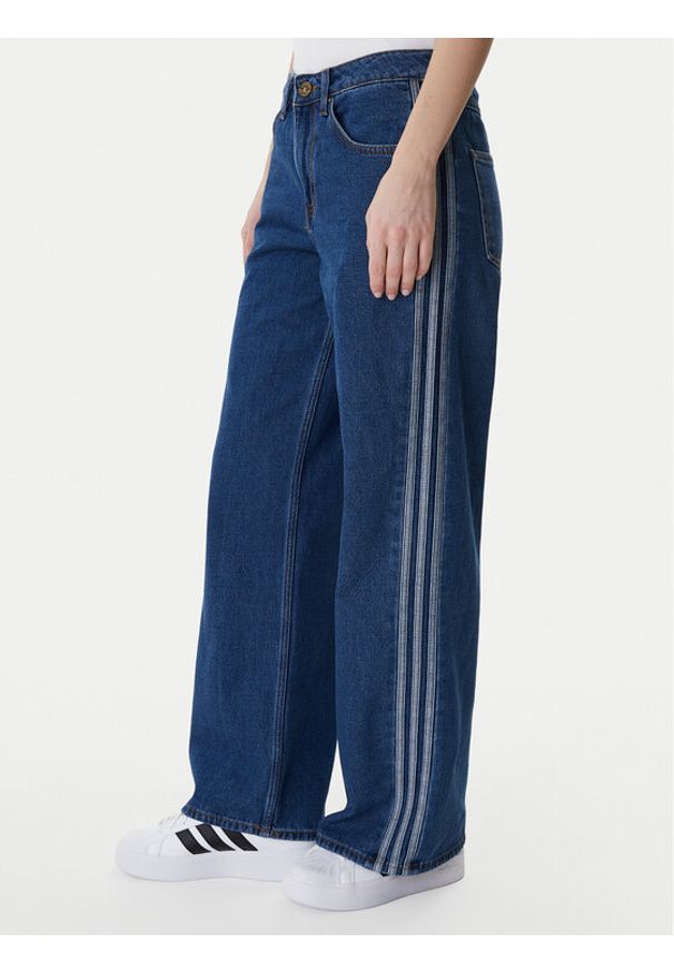 Adidas - adidas Jeansy Firebird KD2935 Niebieski Regular Fit. Kolor: niebieski