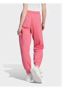 Adidas - adidas Spodnie dresowe ALL SZN Fleece IM0334 Różowy Loose Fit. Kolor: różowy. Materiał: bawełna