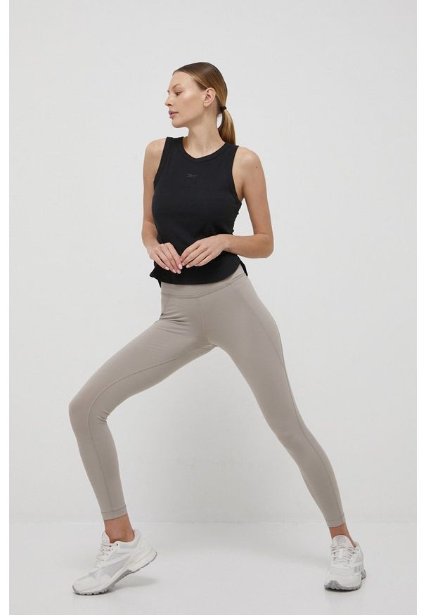 Reebok legginsy treningowe Lux damskie kolor beżowy gładkie. Kolor: beżowy. Materiał: skóra, materiał. Wzór: gładki. Sport: fitness
