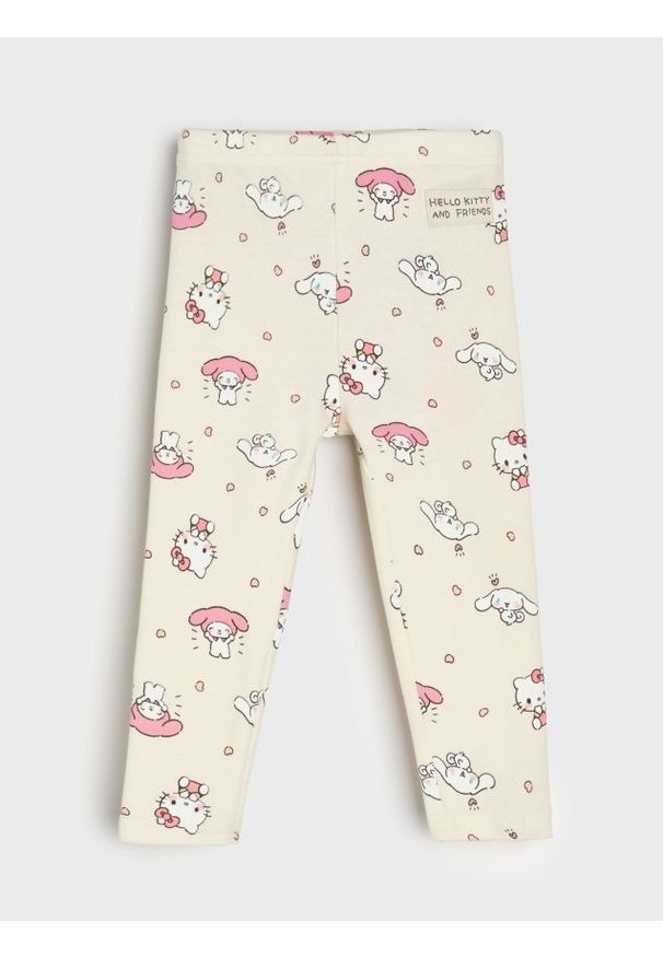Sinsay - Bawełniane legginsy ze wzorem Hello Kitty - kremowy. Kolor: kremowy. Materiał: bawełna. Wzór: motyw z bajki