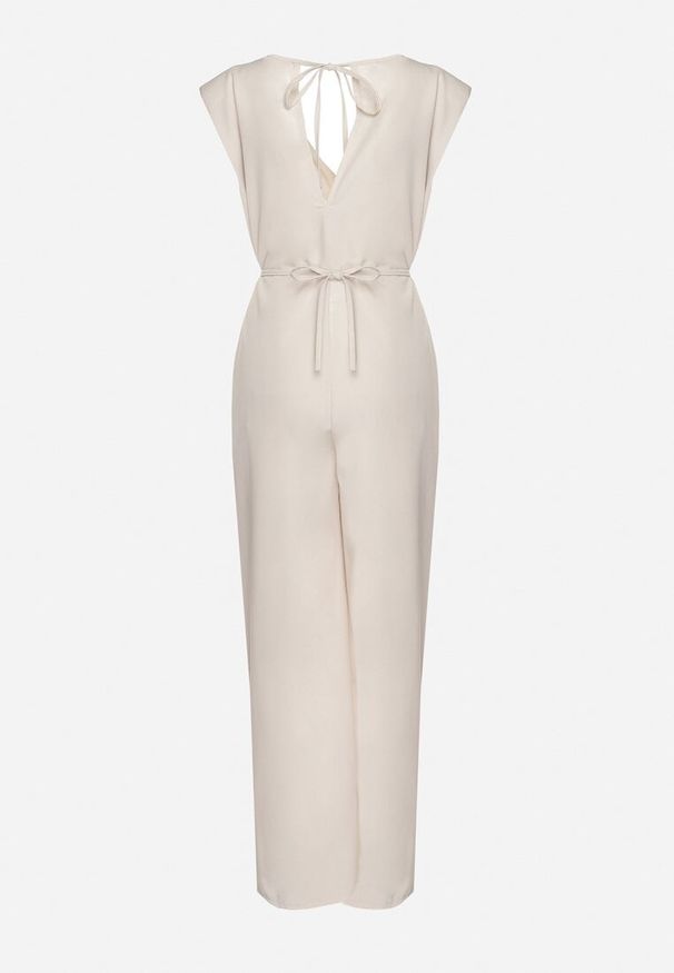 Born2be - Beżowy Wiązany Kombinezon z Prostymi Nogawkami i Wiskozą oraz Kwiatową Aplikacją Dimenna. Kolor: beżowy. Materiał: wiskoza. Wzór: aplikacja, kwiaty. Styl: elegancki