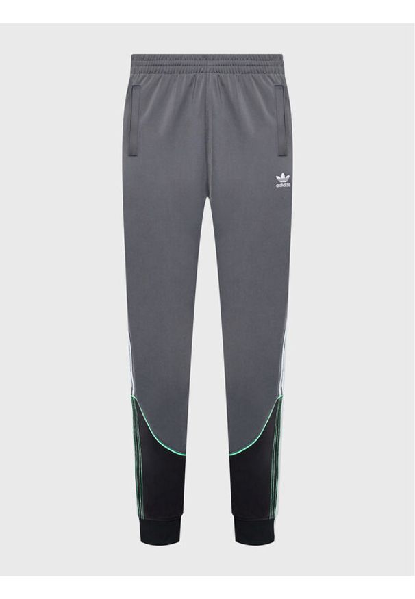 Adidas - adidas Spodnie dresowe Tricot Sst HI3006 Szary Regular Fit. Kolor: szary. Materiał: syntetyk