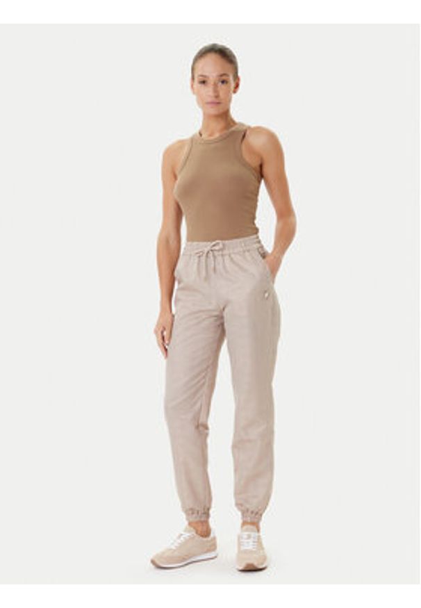 Guess Spodnie dresowe V5YB14 WHFU0 Beżowy Regular Fit. Kolor: beżowy. Materiał: syntetyk
