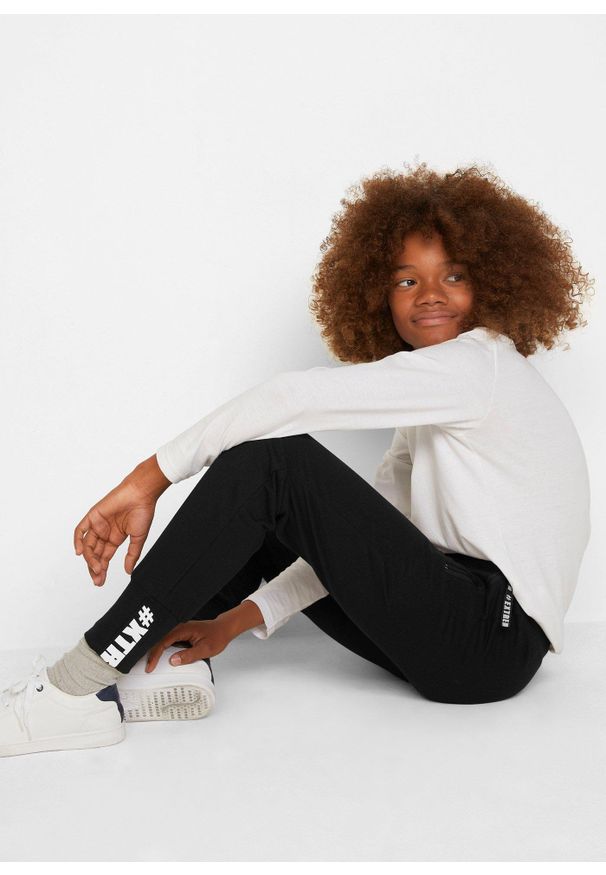 bonprix - Spodnie dresowe z czystej bawełny. Okazja: do domu. Kolor: czarny. Materiał: bawełna, dresówka. Wzór: nadruk. Styl: sportowy