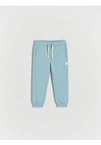 Reserved - Spodnie jogger - niebieski. Kolor: niebieski. Materiał: dzianina, bawełna