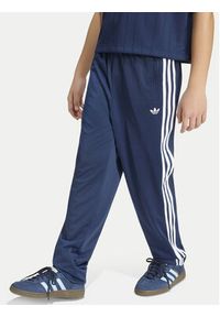 Adidas - adidas Spodnie dresowe Firebird HZ6650 Granatowy Regular Fit. Kolor: niebieski. Materiał: syntetyk #6