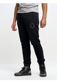 Big-Star - Spodnie dresowe męskie Kersyn 906/ Ajron 906. Kolor: czarny. Materiał: dresówka. Wzór: aplikacja #6
