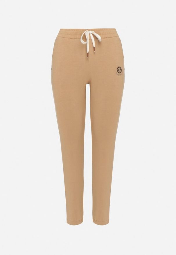 Born2be - Beżowe Spodnie Dresowe Zwężane z Kieszeniami i Gumką w Pasie Lerikas. Okazja: na co dzień. Kolor: beżowy. Materiał: dresówka. Styl: casual