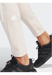 Adidas - adidas Spodnie dresowe Future Icons 3-Stripes IR9155 Różowy Slim Fit. Kolor: różowy. Materiał: bawełna #6