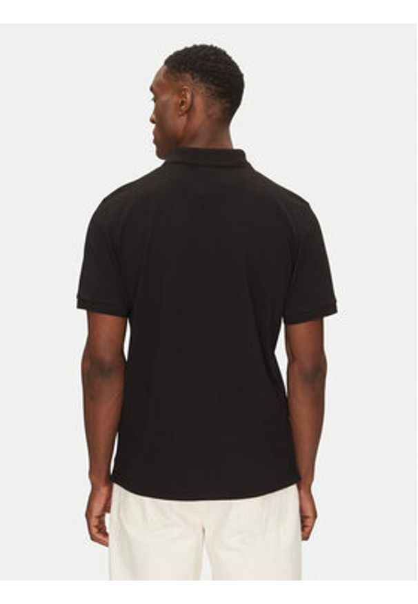 The North Face Polo Essential NF0A8C1P Czarny Regular Fit. Typ kołnierza: polo. Kolor: czarny. Materiał: bawełna