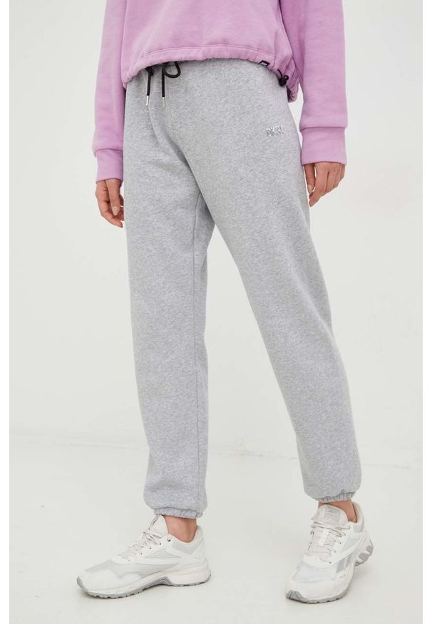DKNY - Dkny spodnie dresowe damskie kolor szary gładkie. Kolor: szary. Materiał: dresówka. Wzór: gładki