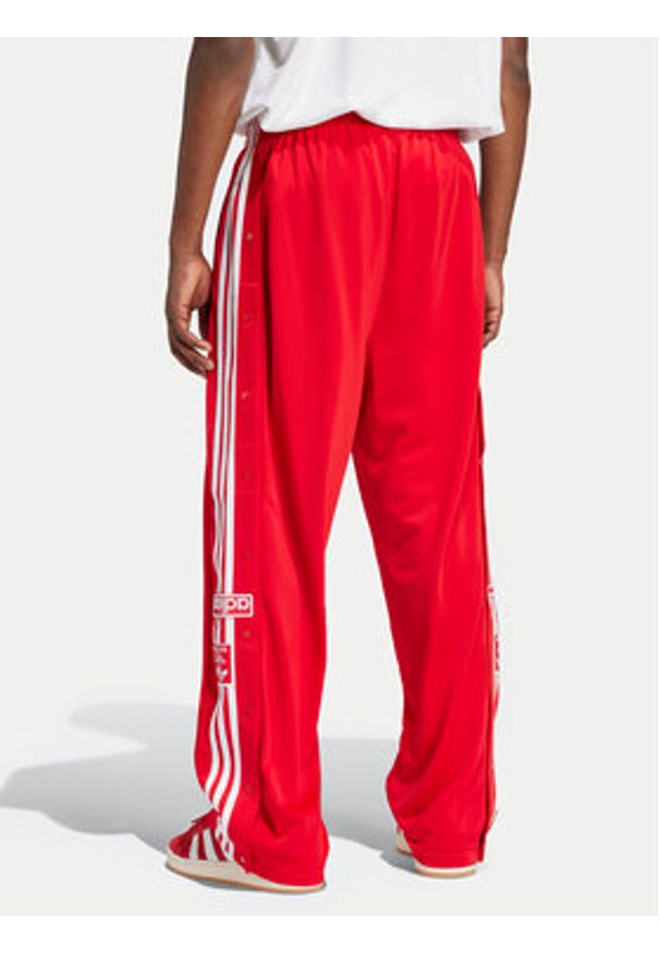 Adidas - adidas Spodnie dresowe Adibreak IY9924 Czerwony Loose Fit. Kolor: czerwony. Materiał: syntetyk