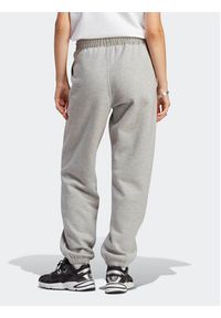 Adidas - adidas Spodnie dresowe Essentials Fleece IA6432 Szary Regular Fit. Kolor: szary. Materiał: bawełna #4