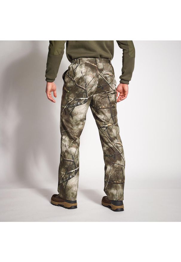 SOLOGNAC - Spodnie myśliwskie Solognac 500 Warm wodoodporne camo treemetic. Kolor: wielokolorowy, brązowy, zielony. Materiał: materiał, tkanina, polar. Sport: outdoor
