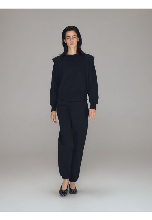 Reserved - Dresowe spodnie - czarny. Kolor: czarny. Materiał: dresówka