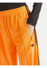 Adidas - adidas Spodnie dresowe adicolor Classic Firebird JY2694 Żółty Loose Fit. Kolor: żółty. Materiał: syntetyk #5