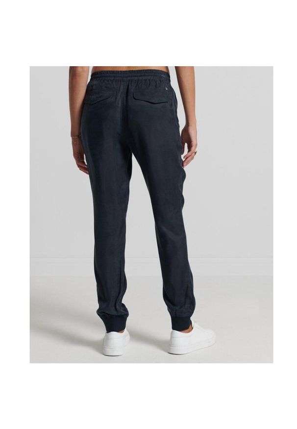 Spodnie turystyczne damskie Superdry Studios Supro Woven Jogger. Kolor: niebieski. Materiał: wiskoza