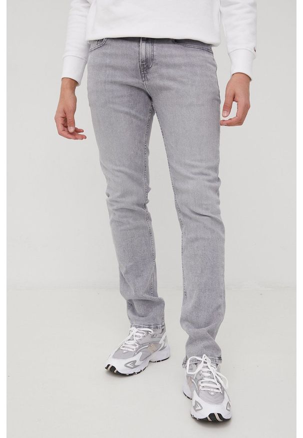 Tommy Jeans jeansy RYAN BF1271 DM0DM13272.PPYY męskie. Kolor: szary
