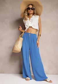 Renee - Niebieskie Spodnie w Stylu Alladynek High Waist Wykończone Gumką w Pasie Riselma. Okazja: na co dzień. Stan: podwyższony. Kolor: niebieski. Styl: sportowy, casual