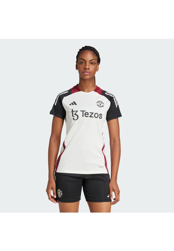 Adidas - Koszulka Manchester United Tiro 24 Training. Kolor: biały, czarny, wielokolorowy. Materiał: materiał. Sport: piłka nożna
