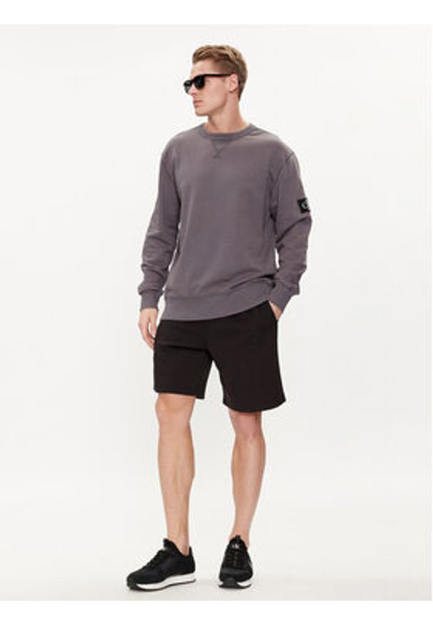 Calvin Klein Jeans Szorty sportowe Logo Repeat J30J325129 Czarny Regular Fit. Kolor: czarny. Materiał: bawełna, syntetyk. Styl: sportowy