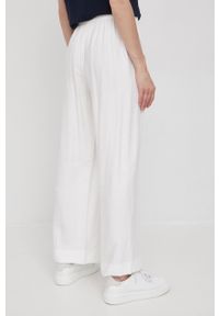 DKNY - Dkny spodnie P2CK8K68 damskie kolor beżowy szerokie high waist. Stan: podwyższony. Kolor: beżowy. Materiał: tkanina #2