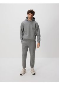 Reserved - Spodnie dresowe slim fit - jasnoszary. Kolor: szary. Materiał: dresówka #1