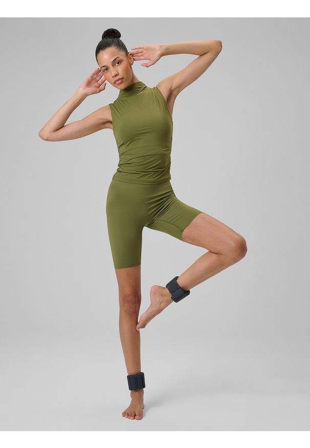 4f - 4F Legginsy kolarki do jogi damskie - oliwkowe M. Stan: podwyższony. Kolor: oliwkowy, brązowy, wielokolorowy. Materiał: włókno, skóra. Długość: długie. Wzór: gładki. Sport: joga i pilates